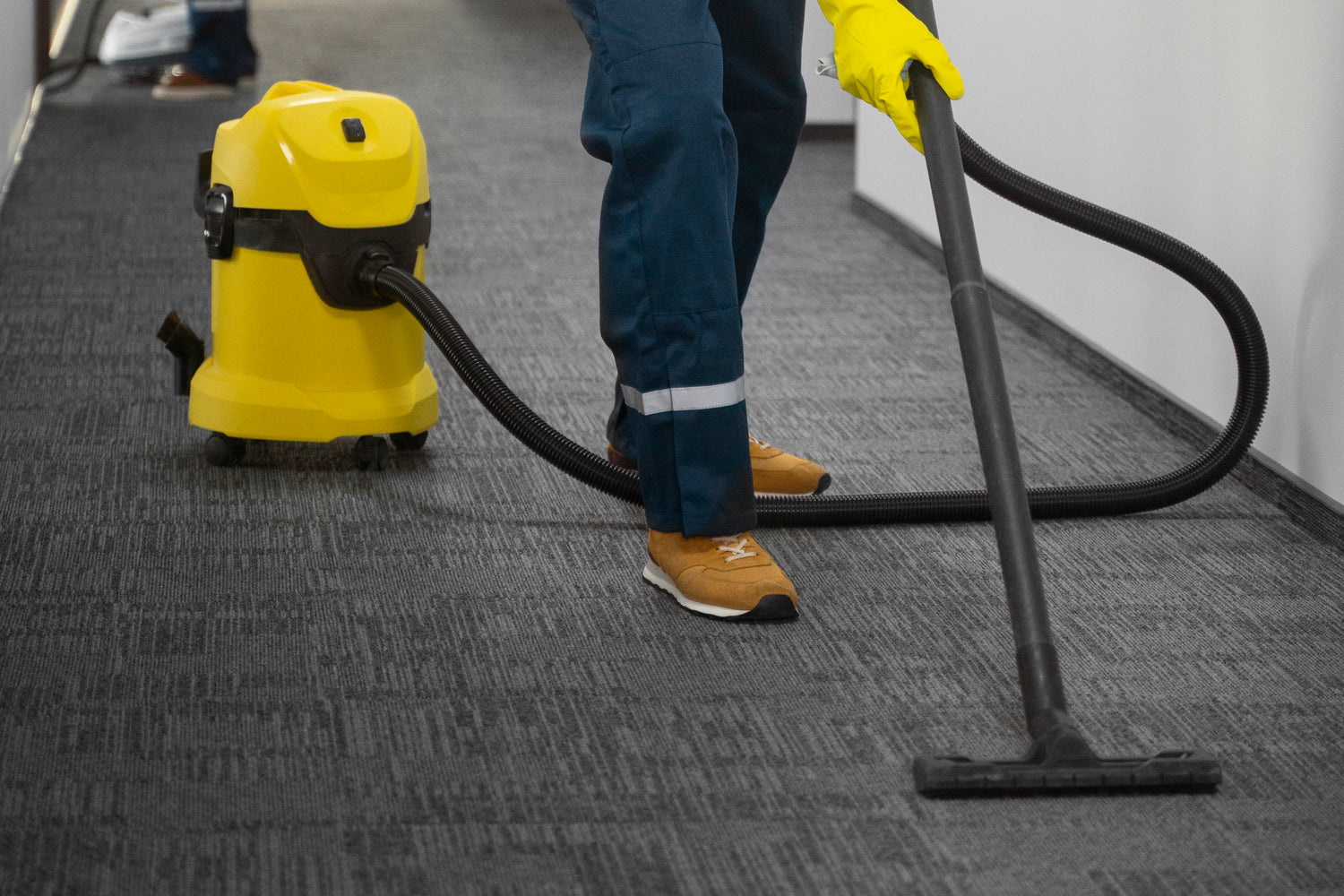man cleaning carpet professional